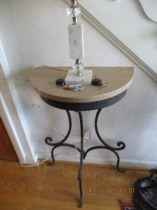Marble top with lower wrought iron scrolled base