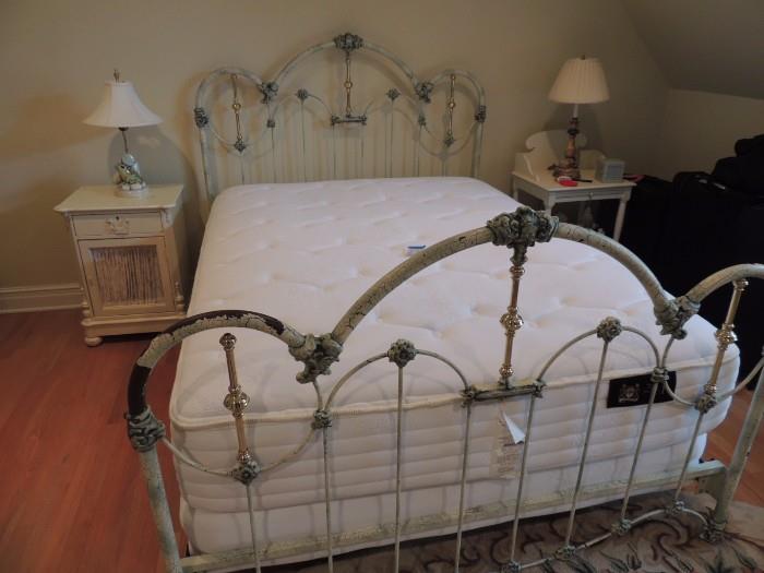 white iron bed with green crackle paint. Mattress not for sale