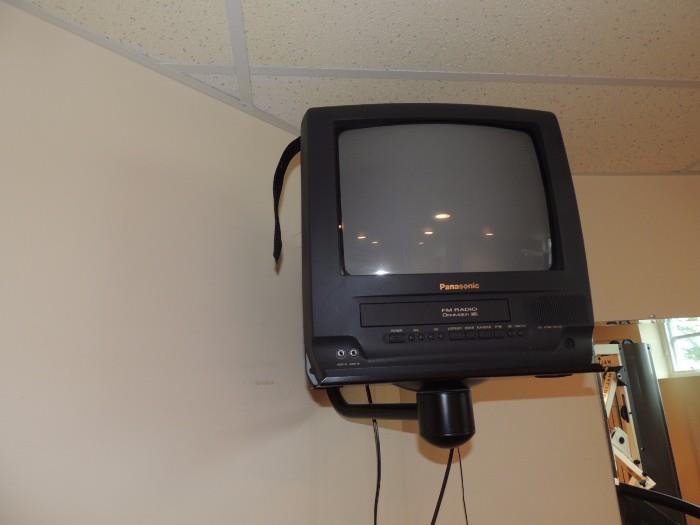 exercise room tv on mounted shelf