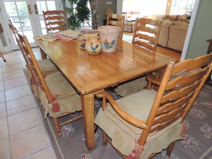 French Country table with two leaves, six chairs with custom cushions and shirts