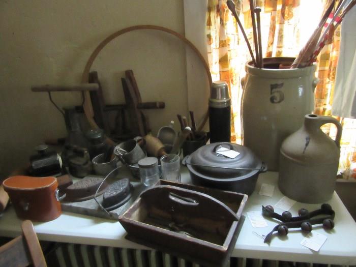 Primitives  early knife box, cheese boxes, firkins, cast iron pot, sad irons.  early bells.