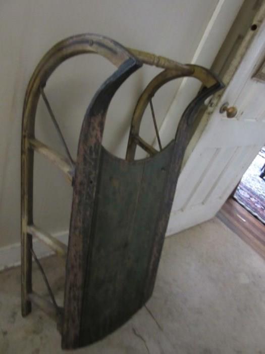 Early sled used to carry milk cans.  
