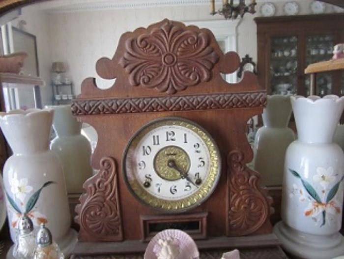This clock is oak body and is a Gilbert clock. The two vases are English Briatol gass. This clock was marked sold. IT Is NOt Sold. Nothing sells until the day of the sale 