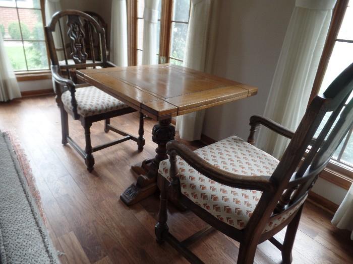 Very nice antique oak game table, set of 4 armchairs