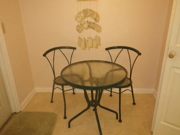 Ice Cream Parlor style table and chairs, with stone mobile hanging above