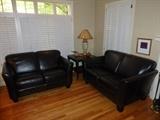 Two Espresso Brown Leather Loveseats, End Table w/ Shelf