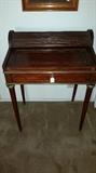 Small antique cherry wood roll top secretary writing desk.