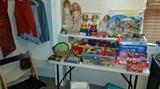 Toys including vintage dolls, large legos, games and wooden blocks.