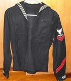 WWII Navy issue stacks military issue clothing.