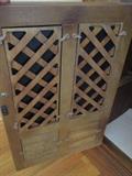 The lower doors of the hutch may be switched out to a lattice look if desired