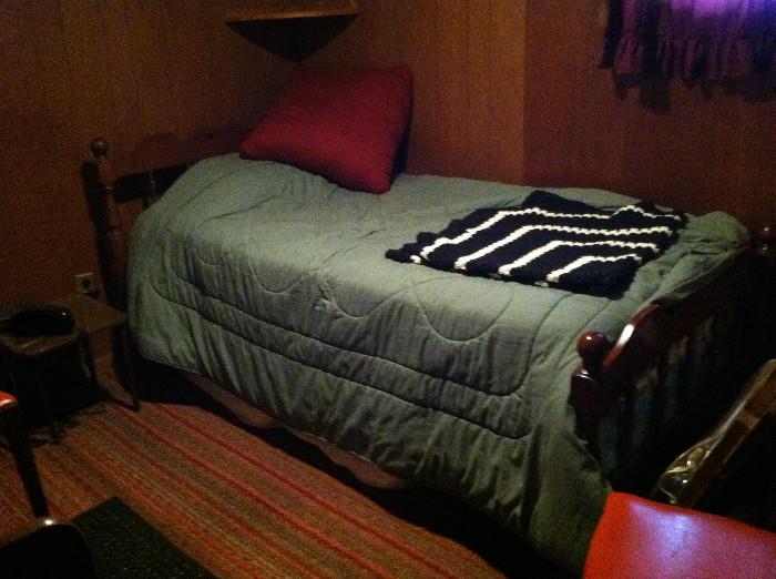 Twin bed with good wood headboard.