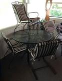 Round wrought iron table and 5 chairs
