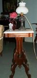 One of two alike Victorian walnut marble top side tables.