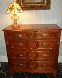 1880s Four drawer walnut and burl dresser base with wood escutcheons and leaf pulls