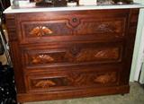 1880s three drawer marble top walnut and burl dresser base/chest on rollers, with wooden fruit pulls and escutcheons