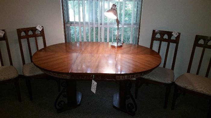 Table with 4 chairs and leaf insert pictures.