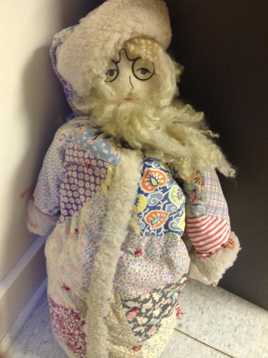 Antique doll with quilted jacket