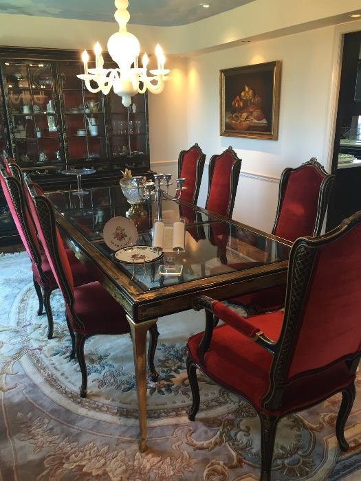 Master craft dining room table, 8 ebony and gilt French-style chairs, Japanned period style breakfront.
