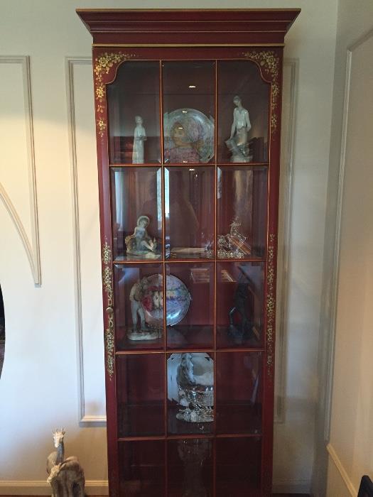 Pair of red lacquered lighted curio cabinets.