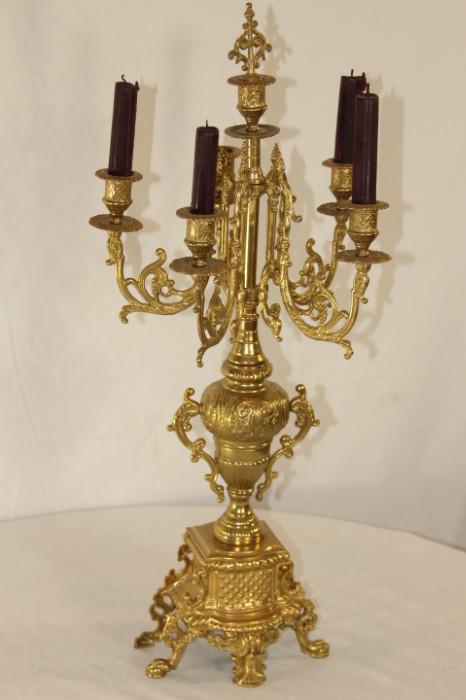 Furnishing – Golden candelabra. Piece has five candle holders. Intricately designed. Lovely piece. 