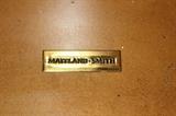 Furnishing – Decorative box. Piece resembles a treasure chest. Golden inside and black and golden pattern exterior. Footed piece. Marked Maitland-Smith. In very nice condition