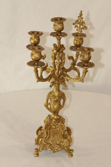 Furnishing – Golden candelabra. Piece has five candle holders. Intricately designed. Lovely piece