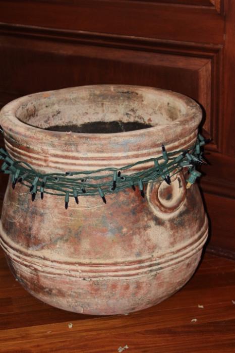 Ceramics – Large pot. Piece has string lights wrapped around the top. Piece is unmarked. Some visible scrapes and nicks to outer surface. Solid piece.