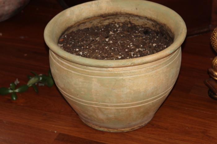 Ceramics – Large pot. Piece has string lights wrapped around the top. Piece is unmarked. Some visible scrapes and nicks to outer surface. Solid piece.