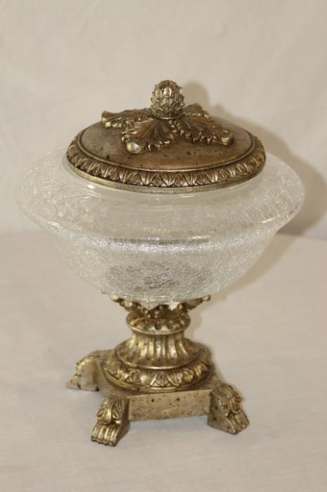 Furnishing – Decorative glass bowl on a metal stand. Piece is lovely. Glass bowl has cracked glass pattern. Bowl has metal base and matching lid. 