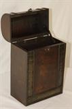 Furnishing – Tall wooden chest. Piece has a rounded top with detailed trim. One handle on top and one locking mechanism. Nice piece. No major scratches or nicks.