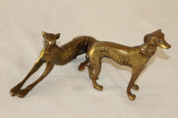 Furnishing – Pair of golden dog figurines. One piece is laying while other is standing. Nice pair. Unmarked