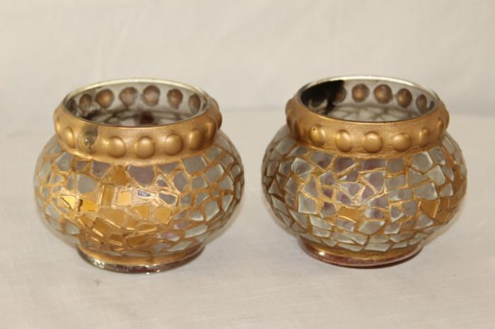 Furnishing – Pair of glass candle holders. Pieces are embellished with golden design. Visible soot marks from candle near top. 