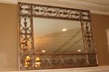 Furnishings – Mirror. Hanging rectangular mirror. Piece has golden floral accents around trim. Framed piece hangs flush to wall. Overall in great condition.