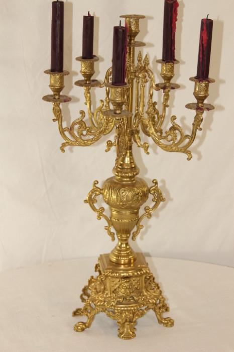 Furnishing – Golden candelabra. Piece has six candle holders. Intricately designed. Lovely piece.
