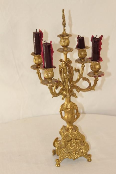 Furnishing – Golden candelabra. Piece has six candle holders. Intricately designed. Lovely piece.