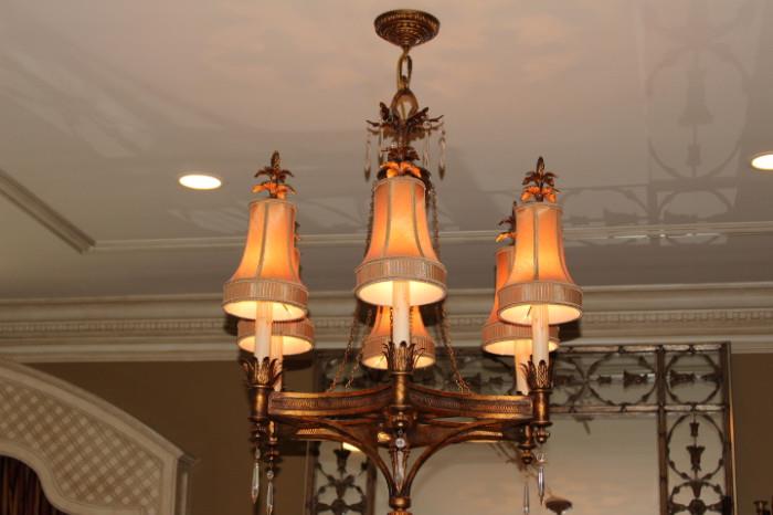 Furnishings – Hanging candelabra. Piece has a six faux candles with shades. Hanging crystals from each piece. Ornately made with golden leaf accents. In very nice condition.