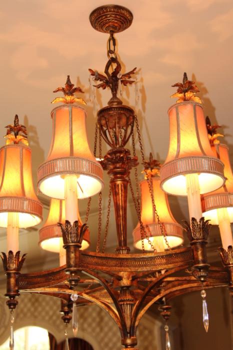 Furnishings – Hanging candelabra. Piece has a six faux candles with shades. Hanging crystals from each piece. Ornately made with golden leaf accents. In very nice condition.