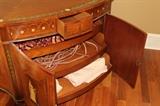 Furniture – Decorative wooden cabinet. Piece is flush to wall. Wood is decorated with leaf and floral pattern. Goddess is painted on each door. Doors open up to reveal three extendible shelves. Unique piece beautifully designed. Mint condition