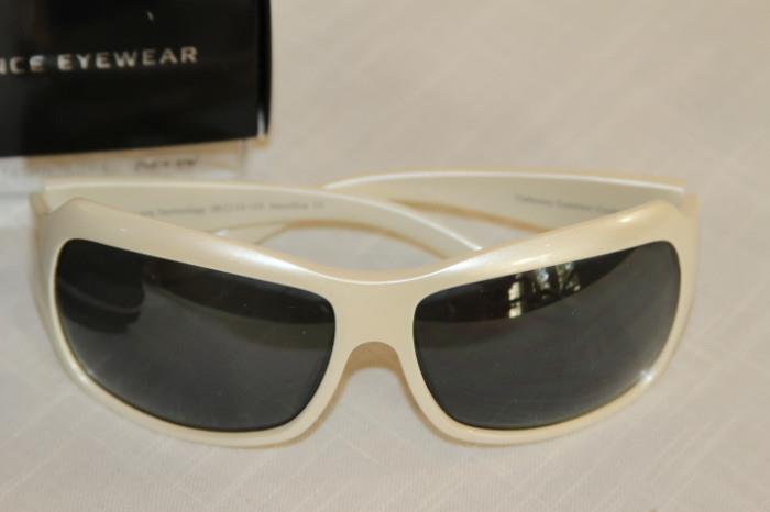 Apparel & Accessories – Pair of Callaway sunglasses. Eyewear comes with case and original box. White plastic rims with dark shades.