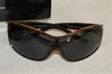 Apparel & Accessories – Pair of Callaway sunglasses. Eyewear comes with case and original box. White plastic rims with dark shades.