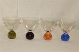 Kitchen – Set of four martini glasses. Pieces have round ball bottom. Each glass has a different colored base. No chips or scratches