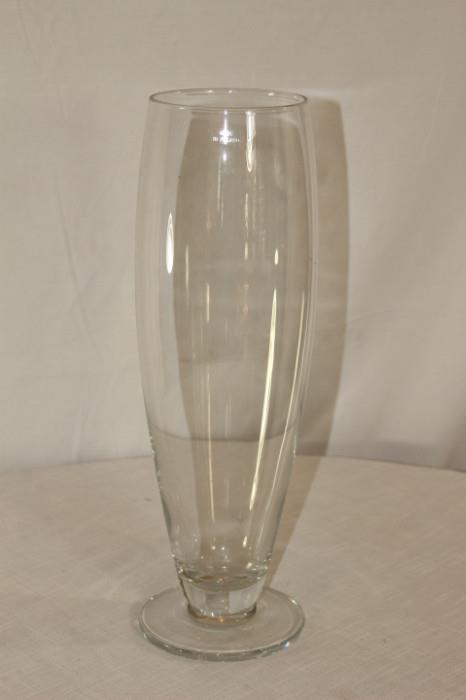 Furnishing – Clear glass tall vase. Piece is on a pedestal. Marked ‘Made in Poland’.