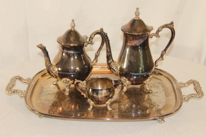 Collectibles – Group lot tea set. Two tea pots, one creamer, and one tray with handles. Whole lot is footed. Tray and creamer marked “Sheridan”. Pieces have signs of tarnishing. Nice collection.