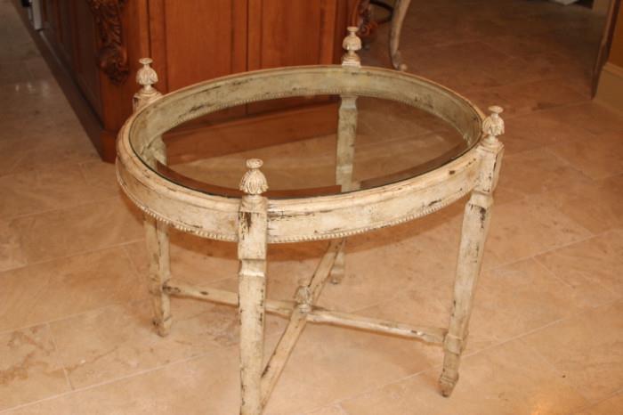 Furniture – Decorative coffee table. Piece has a glass center. In good condition.