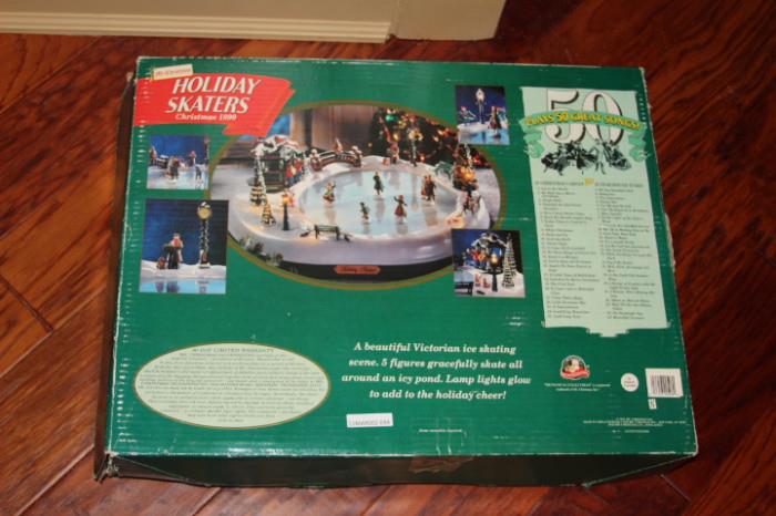 Collectibles – Holiday skaters. Piece is still in original box. Decorative piece with moving skaters. In good condition