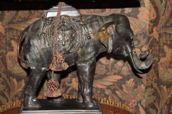 Furnishing – Table top lamp. Piece has a elephant base with a decorative shade.
