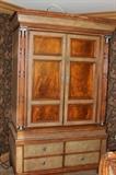 Furniture – Dresser. Piece has four piece drawers on bottom. One drawer is missing a handle. Other handles are lion head shaped. Two doors on top open to reveal a TV stand. Piece marked ‘Maitland-Smith’. Visible ware to wood