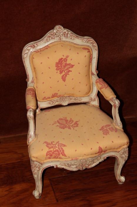 Furniture – Single piece arm chair. Wooden painted frame with upholstered backrest and seat. Upholstery is beige with a pink floral pattern. Slight ware to paint.