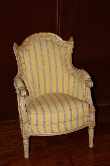 Furniture – Single piece arm chair. Piece is upholstered with a cushioned seat. Upholstery is yellow with a blue striped pattern.
