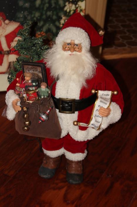 Collectibles – Santa figurine. Piece is beautifully crafted and dressed in traditional Santa suit and is holding a bag or toys with a list of children’s names. Lovely piece.